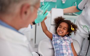 Central Dental Family - Dentist talking to a young patient about dental anxiety