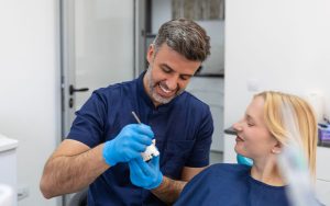 Central Dental Family - Dentist talking to a patient